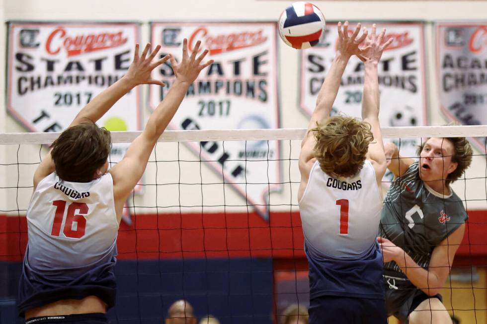 Arbor View outside hitter Mark Blanchard (5) hits against Coronado’s Luke Wilkinson (16) ...