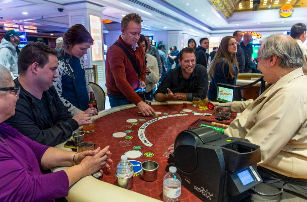 The last hand of blackjack is played and chips collected during the final night of gaming at th ...