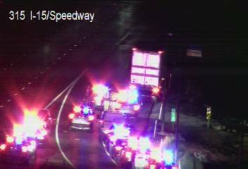 A heavy police presence on Interstate 15 northbound behind a semi-truck at the Speedway exit ab ...