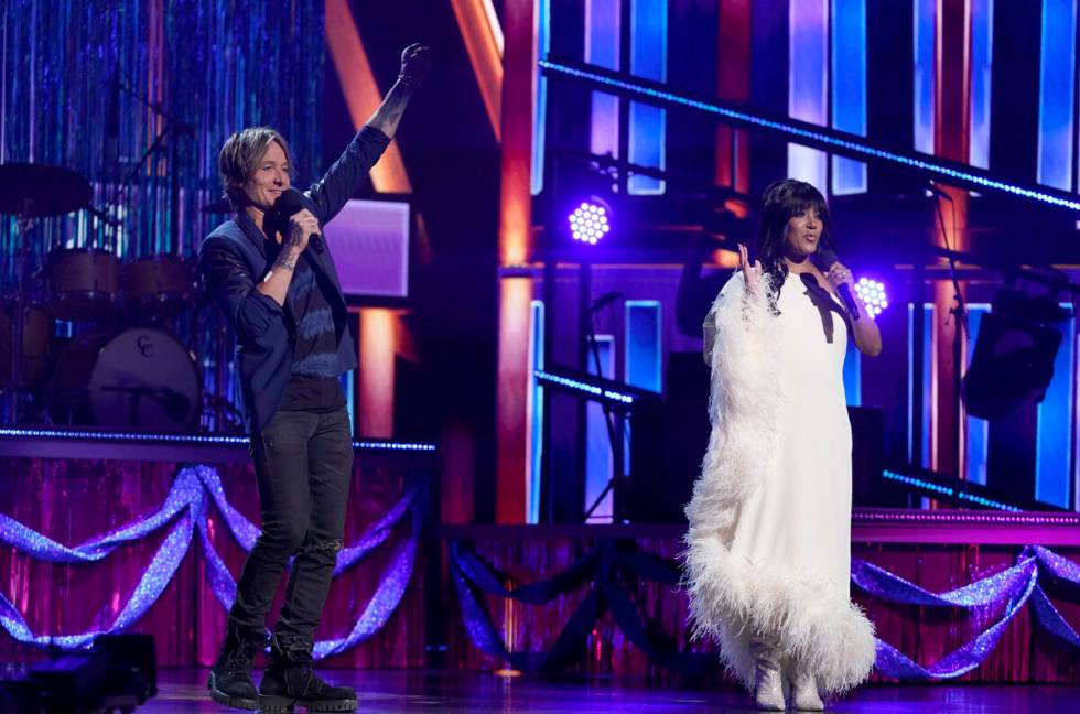 Hosts Keith Urban, left, and Mickey Guyton speak at the 56th annual Academy of Country Music Aw ...