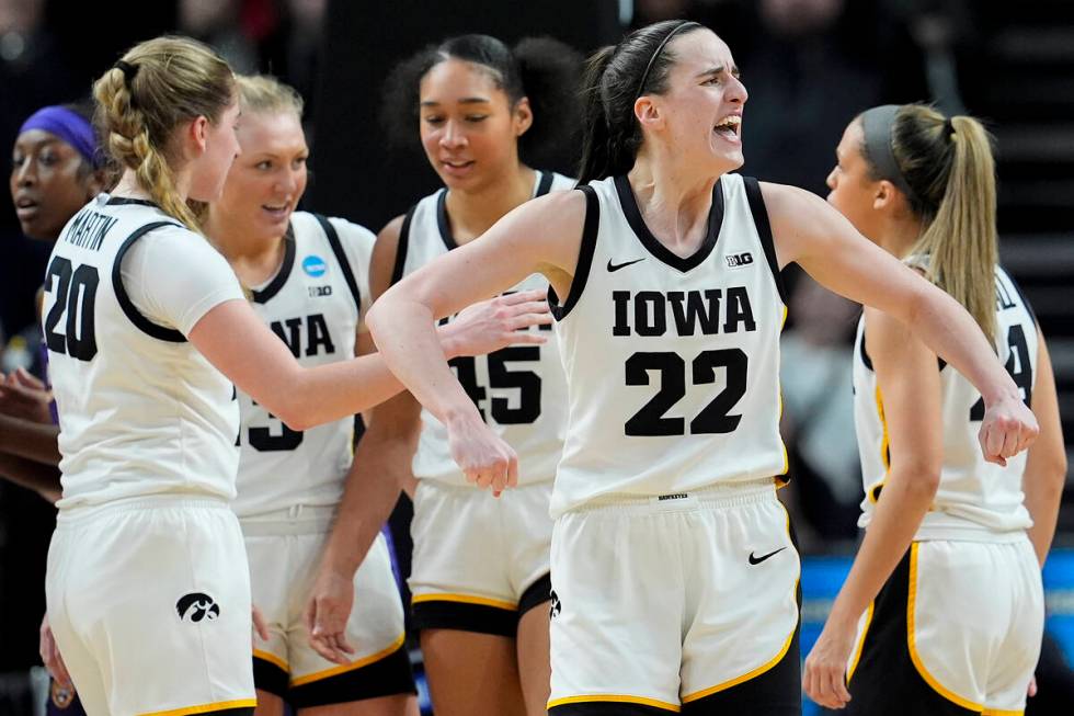 Iowa guard Caitlin Clark (22) reacts during the fourth quarter of an Elite Eight round college ...