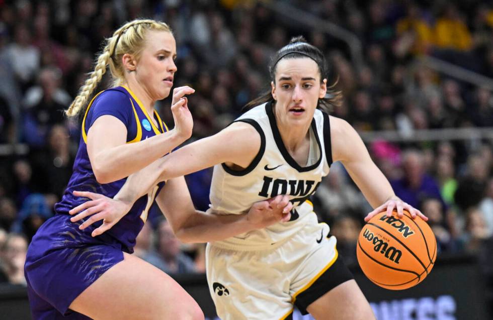 Iowa guard Caitlin Clark (22) is defended by LSU guard Hailey Van Lith (11) during the second h ...