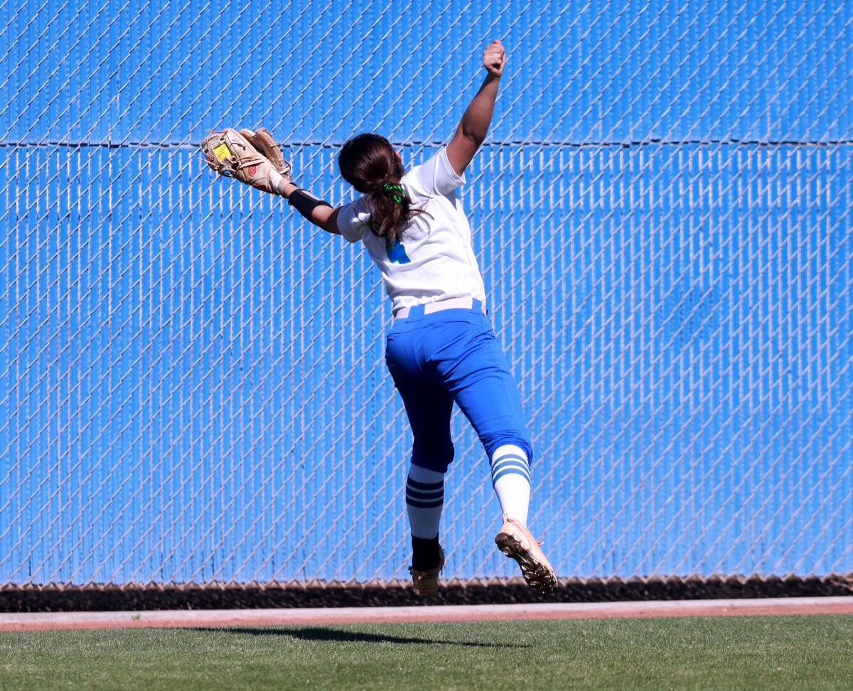 Green Valley center fielder Kalina Carrizales (4) makes a jumping catch against Bishop Gorman ...