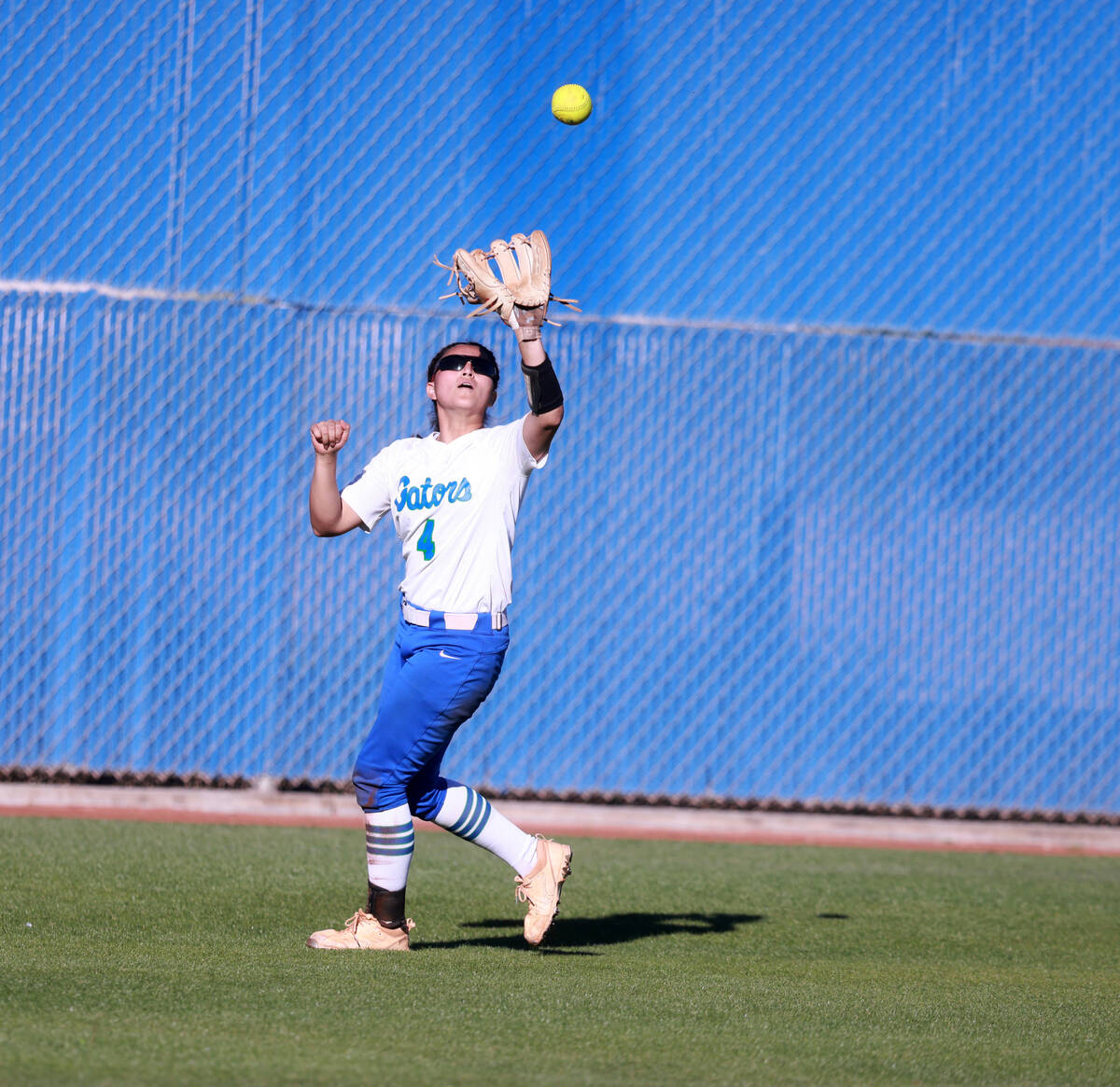 Green Valley center fielder Kalina Carrizales (4) brings in the ball against Bishop Gorman in t ...