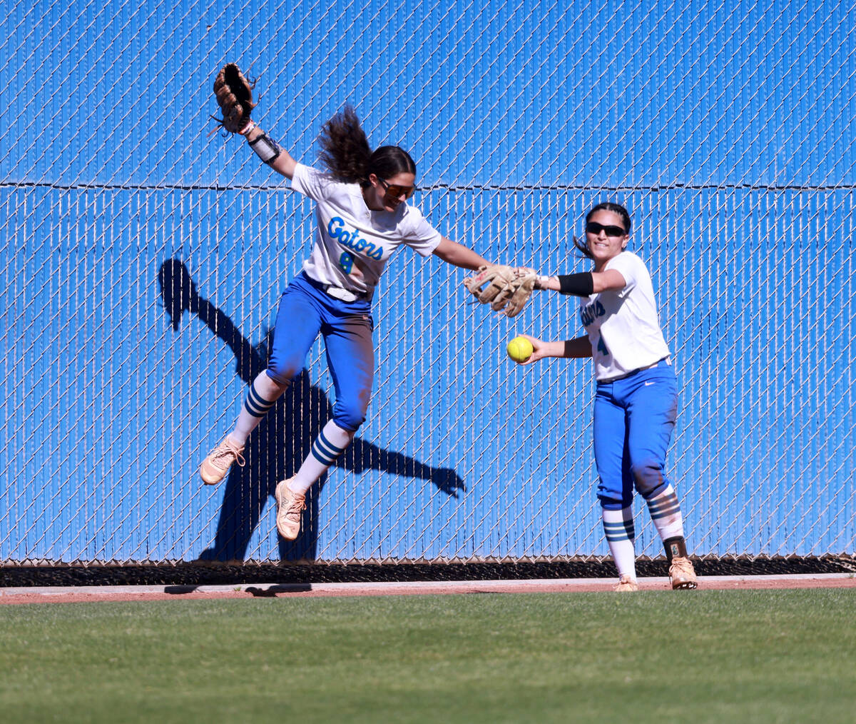 Green Valley’s Green Valley Lyla Baxter (9) celebrates a catch by Kalina Carrizales (4) ...