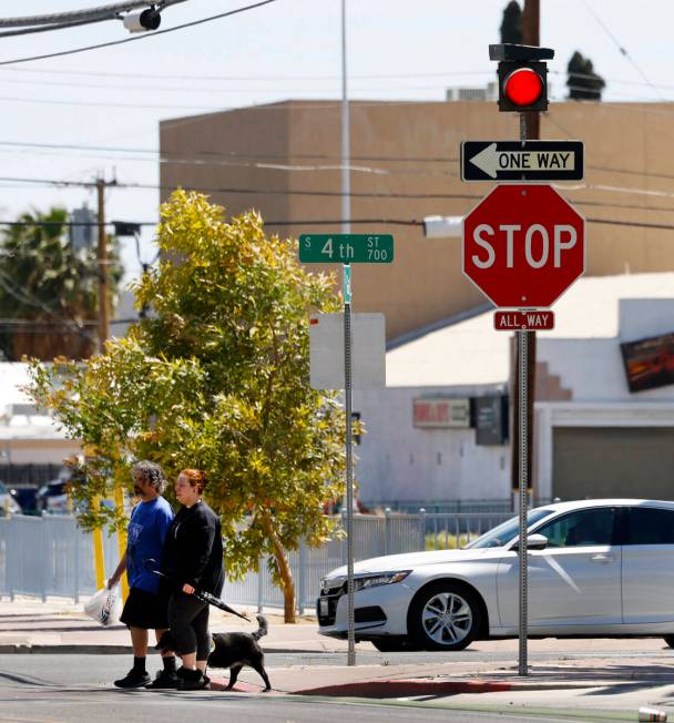 Pedestrians cross Garces avenue where street signals recently added at the intersections of Gar ...