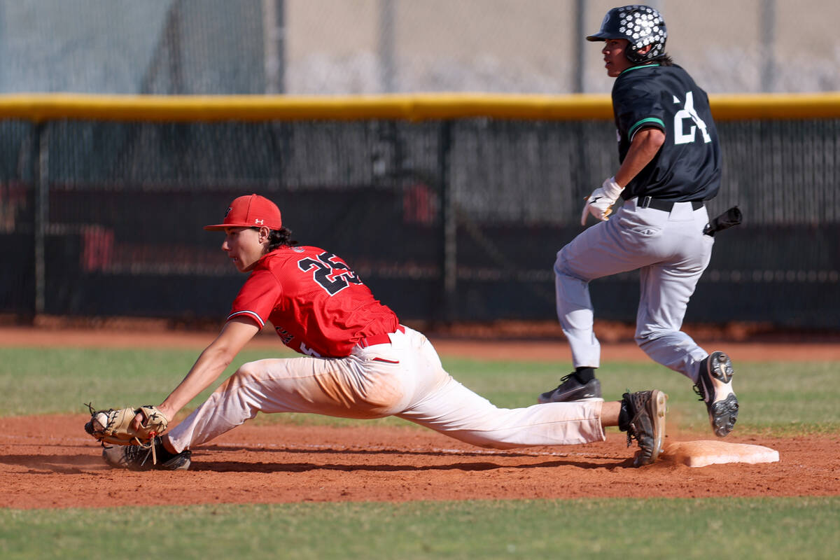 Las Vegas first baseman Dallas Martinez (25) lunges to catch for an out on Palo Verde’s ...
