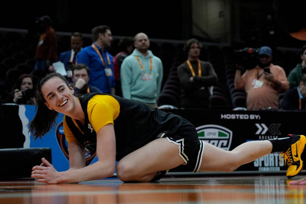 Iowa's Caitlin Clark stretches during a practice for an NCAA Women's Final Four semifinals bask ...