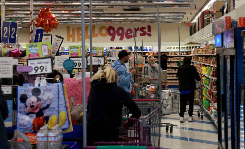 Shoppers make their purchases at the 99 Cents Only store at Flamingo Road and Maryland Parkway ...