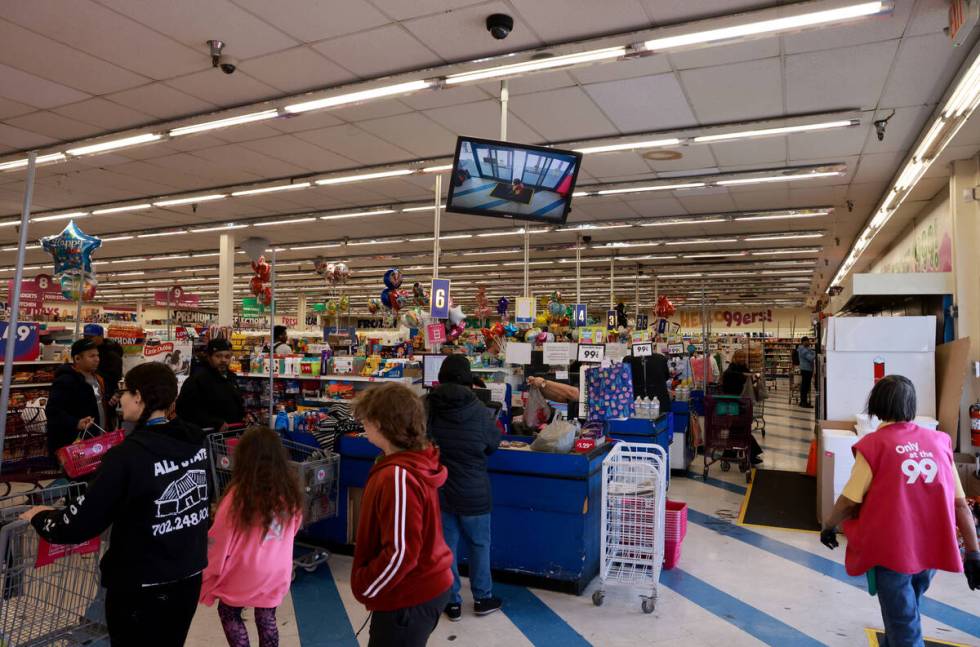 Shoppers make their purchases at the 99 Cents Only store at Flamingo Road and Maryland Parkway ...