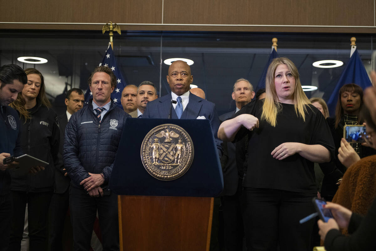 Mayor Eric Adams speaks alongside commissioner Zachary Isco during a news conference at the Ne ...