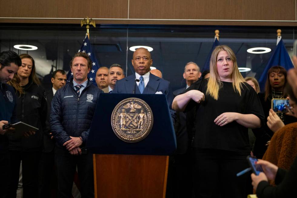 Mayor Eric Adams speaks alongside commissioner Zachary Isco during a news conference at the Ne ...