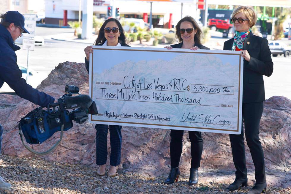 Rep. Susie Lee, D-Nev., right, poses for a photo with Regional Transportation Commission Deputy ...