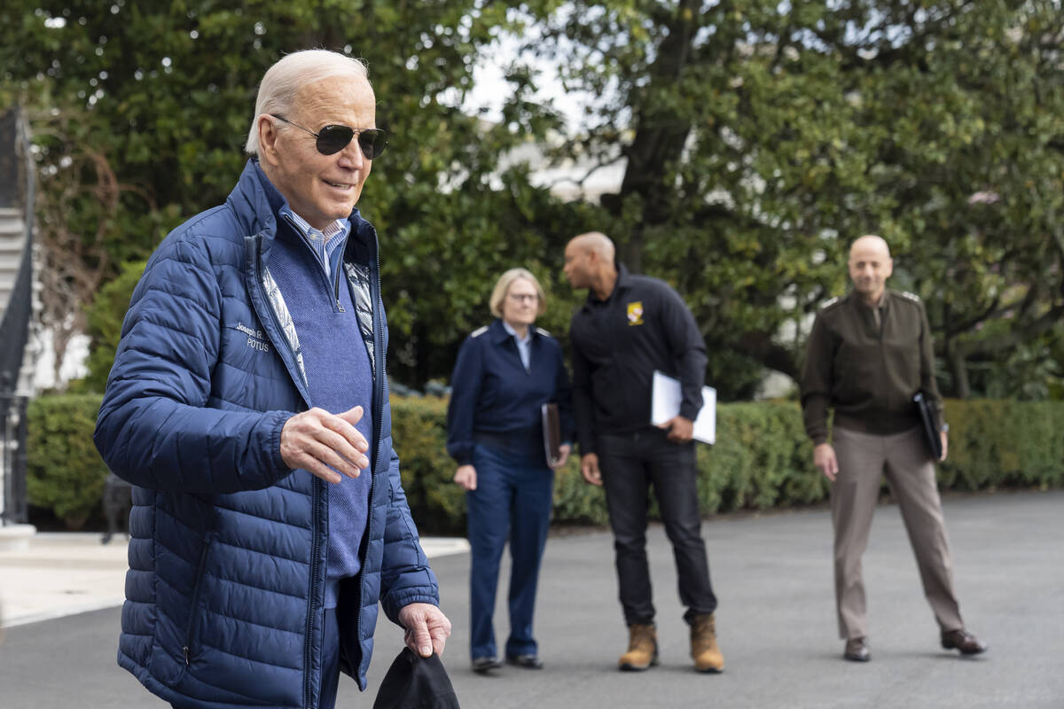 President Joe Biden waves as he walks to Marine One for departure from the South Lawn of the Wh ...