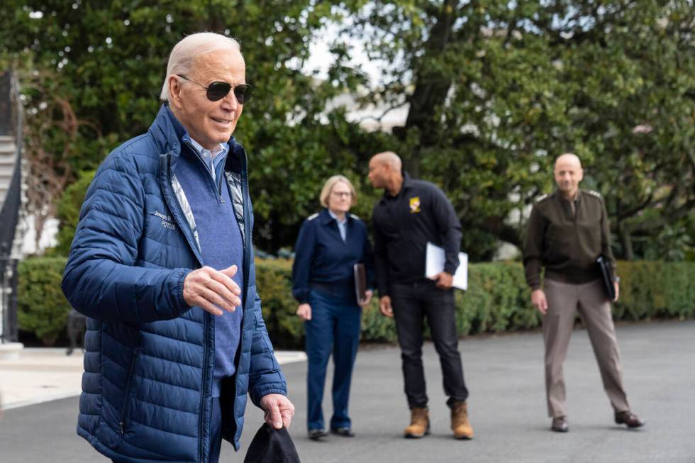 President Joe Biden waves as he walks to Marine One for departure from the South Lawn of the Wh ...