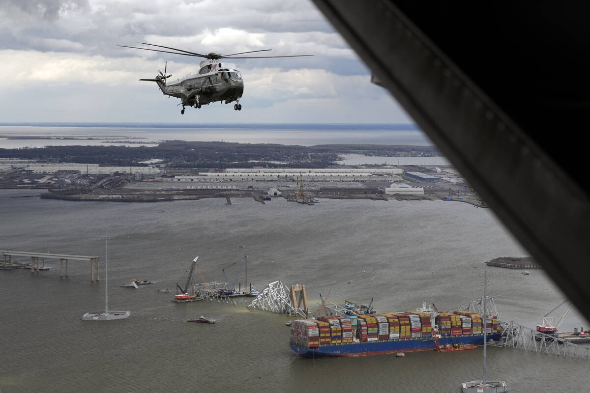 President Joe Biden, aboard Marine One, takes an aerial tour of the collapsed Francis Scott Key ...