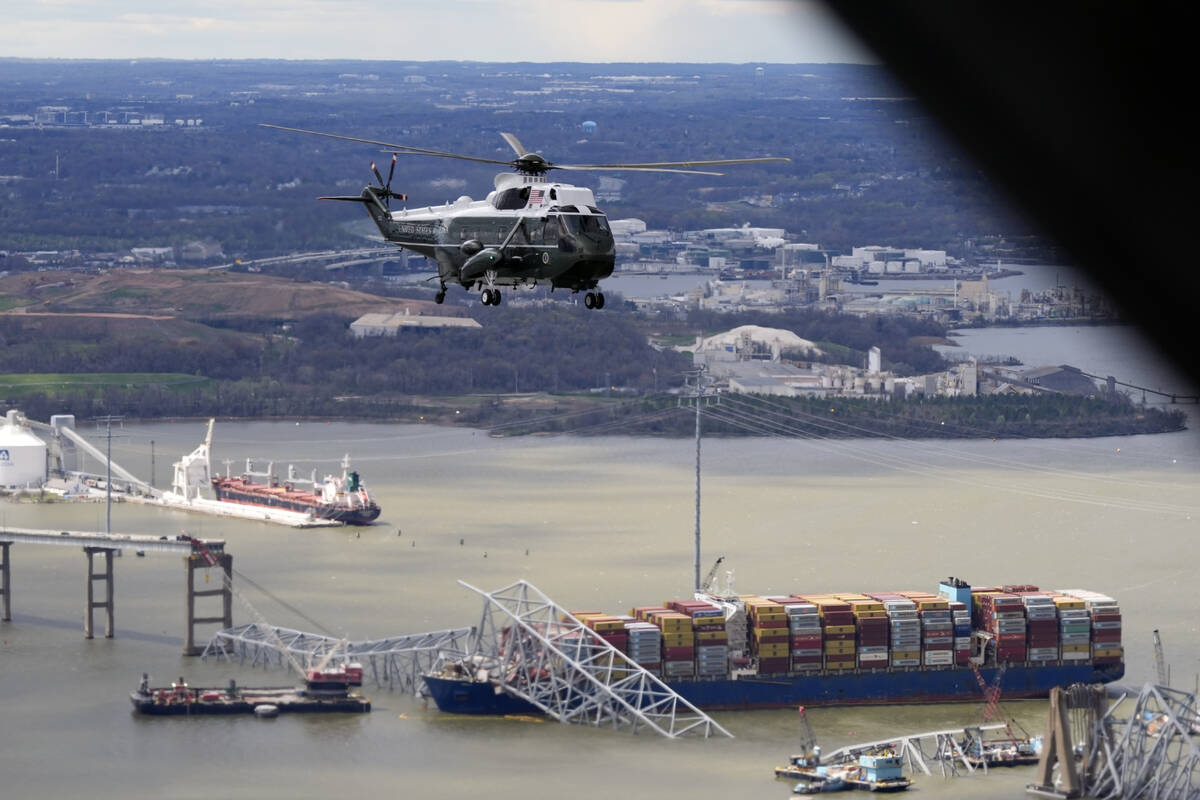 President Joe Biden, aboard Marine One, takes an aerial tour of the collapsed Francis Scott Key ...