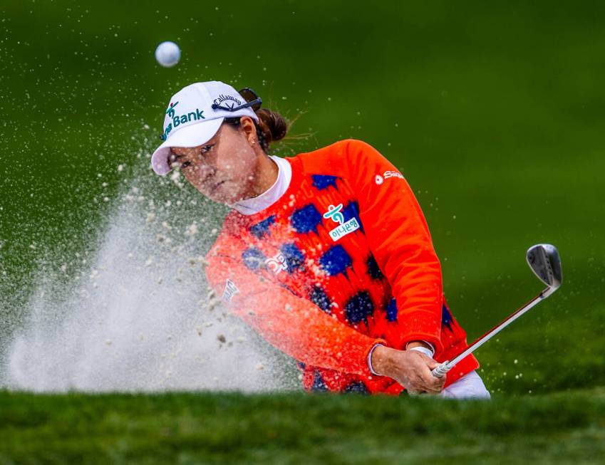 Minjee Lee wedges the ball out of a sand trap onto the green at hole #13 during the third day o ...