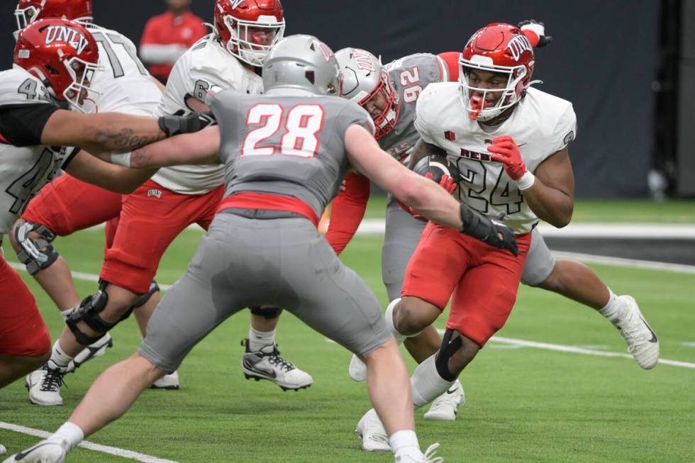 UNLV running back Darrien Jones looks for an opening during UNLV football’s Spring Showc ...