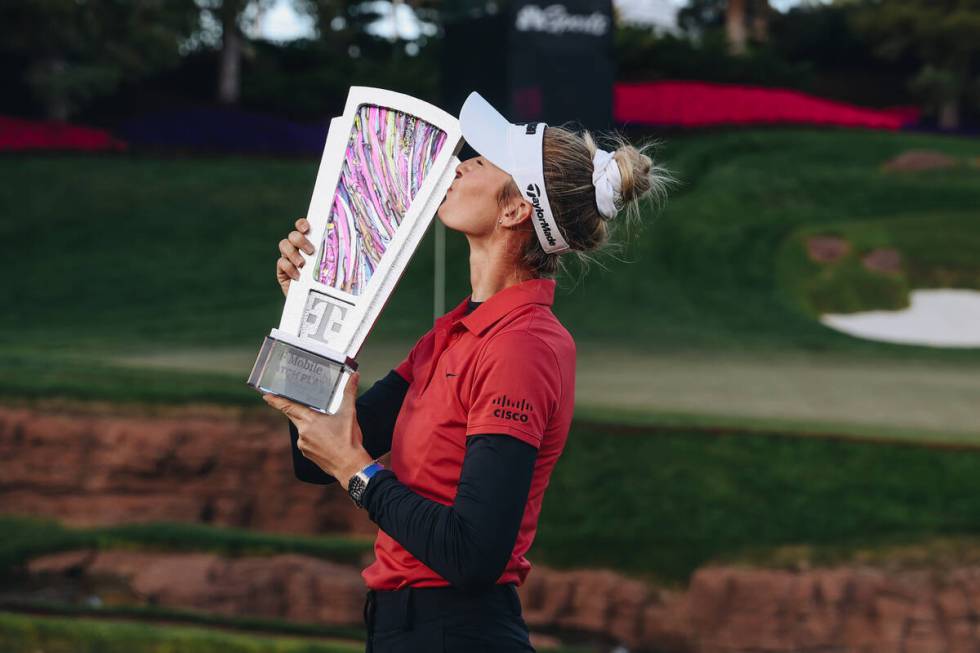 Nelly Korda poses with a trophy during the T-Mobile Match Play championship match at Shadow Cre ...