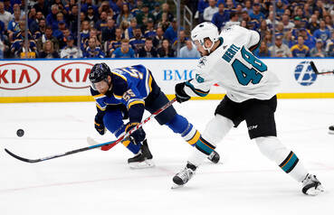 St. Louis Blues defenseman Colton Parayko (55) tries to block the shot of San Jose Sharks cente ...