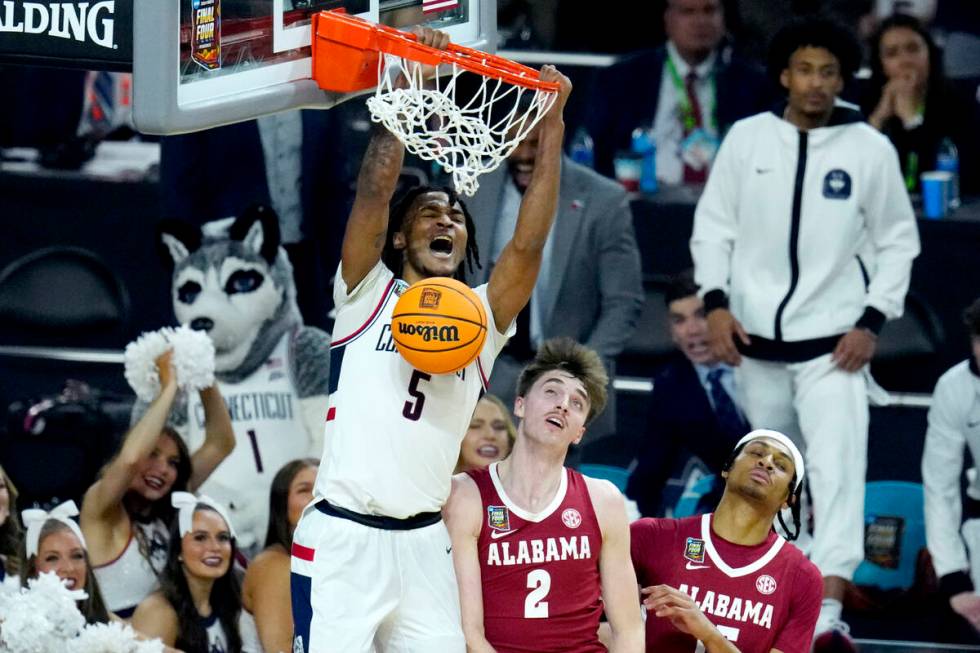 UConn guard Stephon Castle (5) dunks over Alabama forward Grant Nelson (2) during the second ha ...