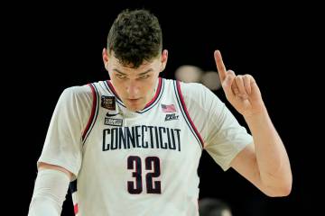 UConn center Donovan Clingan (32) celebrates after their win against Alabama in a NCAA college ...