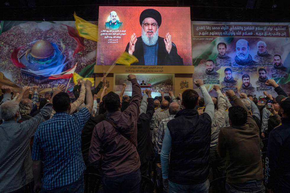 Hezbollah leader Sayyed Hassan Nasrallah speaks in a televised address via a video link during ...