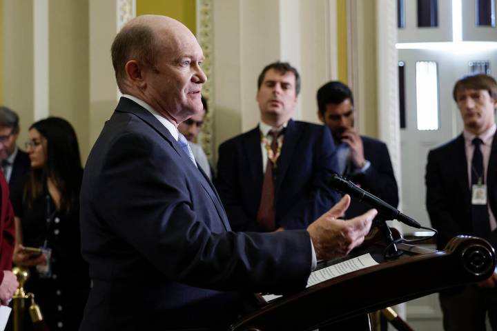 Sen. Chris Coons (D-Del.) speaks to reporters after a weekly policy luncheon with Senate Democr ...