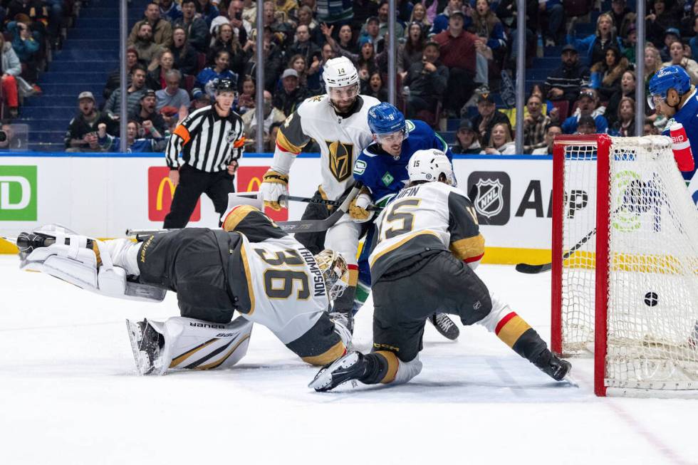 Vancouver Canucks' Conor Garland (8) scores on Vegas Golden Knights goaltender Logan Thompson ( ...