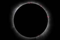 Totality happens during the total solar eclipse viewed from the Reunion Tower on Monday, April ...