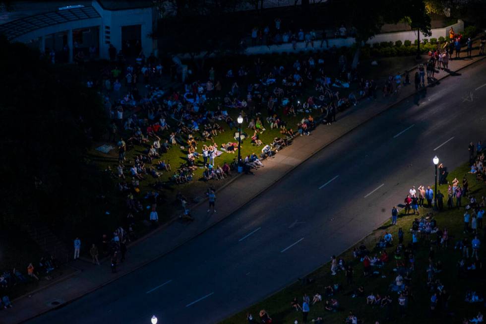 People watch from Dealey Plaza as the totality happens during the total solar eclipse viewed fr ...