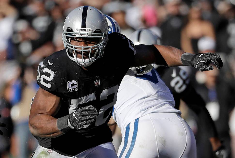 In this Dec. 24, 2016, file photo, Oakland Raiders defensive end Khalil Mack (52) rushes agains ...