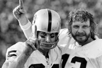 Oakland Raiders receiver Fred Biletnikoff, left, and quarterback Ken Stabler gesture after they ...