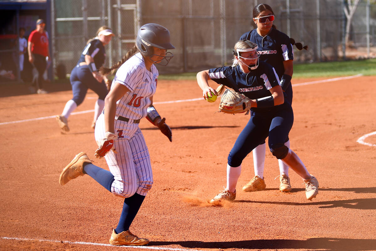 Coronado's Kendall Selitzky (9) throws to first base to out Liberty's Vanessa Saenz (10) during ...