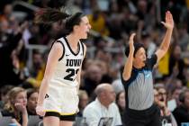 Iowa guard Caitlin Clark (22) reacts after hitting a three-point shot against LSU during the th ...