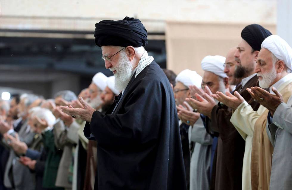 In this photo released by the official website of the office of the Iranian supreme leader, Aya ...