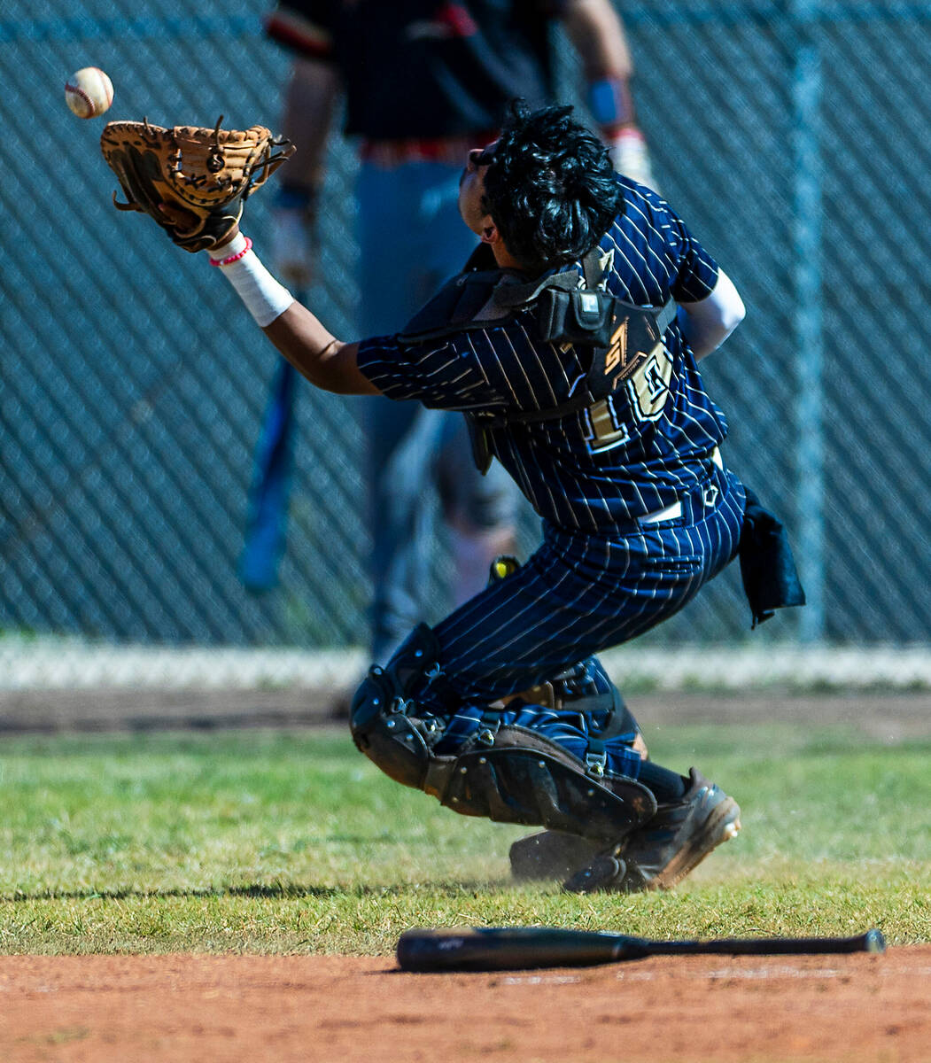 Cheyenne catcher Ramiro Lopez just misses an infield fly ball for Tech during the second innin ...