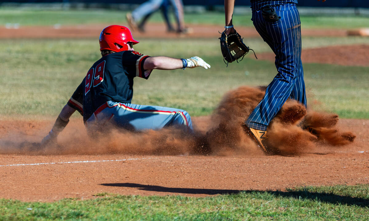 Tech runner Brock Barlow arrives safely at third base beating a Cheyenne throw during the fourt ...