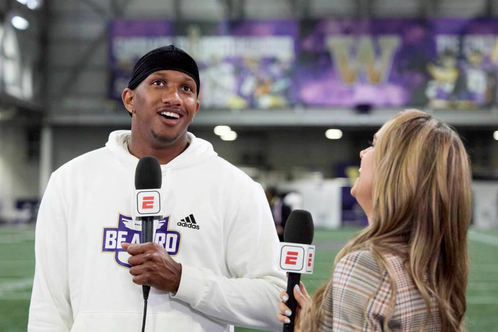 Washington quarterback Michael Penix Jr. is interviewed by ESPN's Molly McGrath during Washingt ...