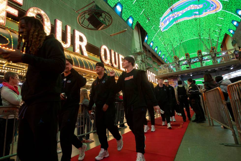 Florida players enter a welcome reception ahead of the Las Vegas Bowl NCAA football game agains ...