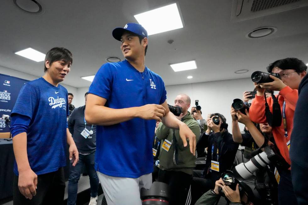 FILE - Los Angeles Dodgers' Shohei Ohtani, right, and his interpreter, Ippei Mizuhara, leave af ...