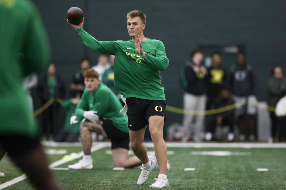 Oregon quarterback Bo Nix (10) participates in a position drill at the school's NFL Pro Day, Tu ...