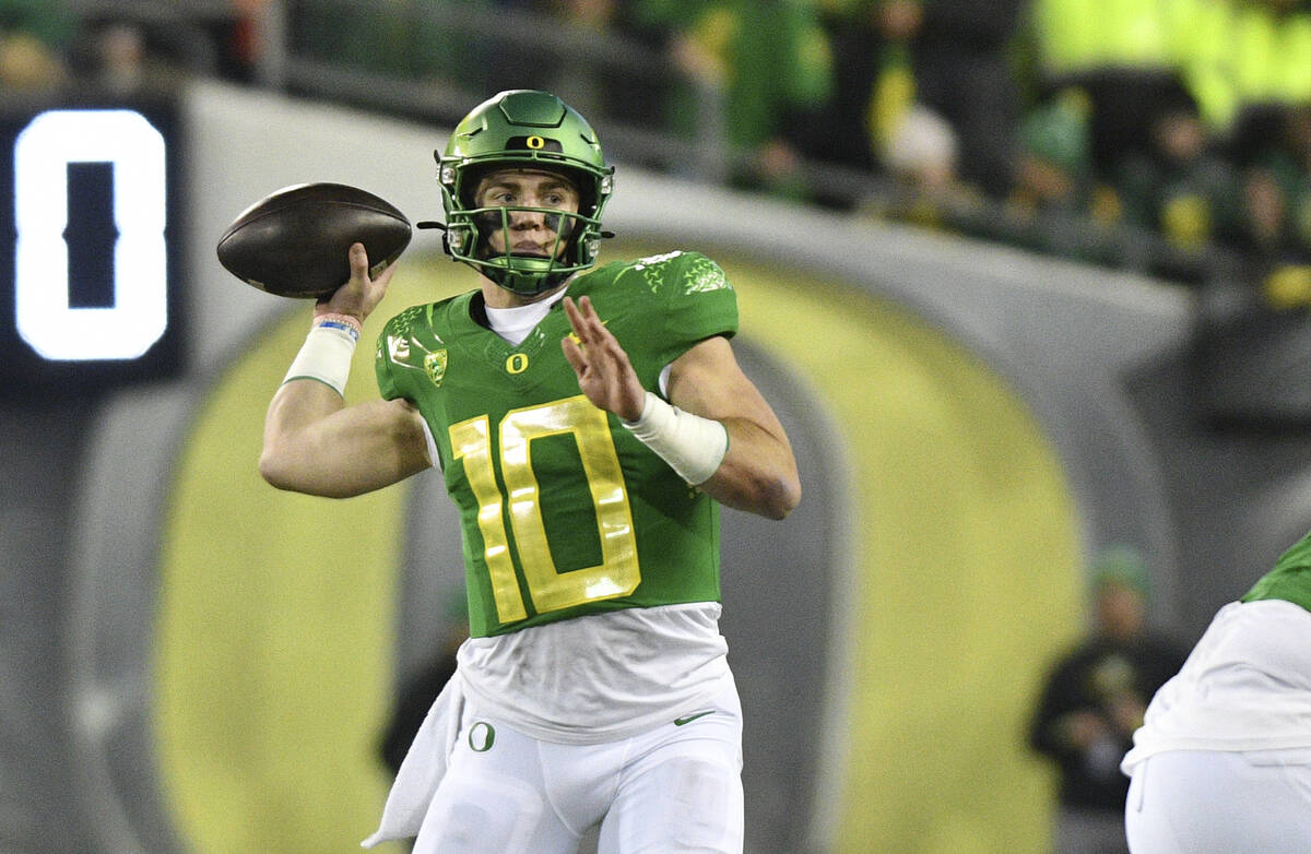 Oregon quarterback Bo Nix throws a pass against Oregon State during the second half of an NCAA ...