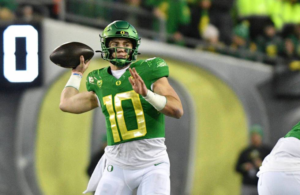 Oregon quarterback Bo Nix throws a pass against Oregon State during the second half of an NCAA ...