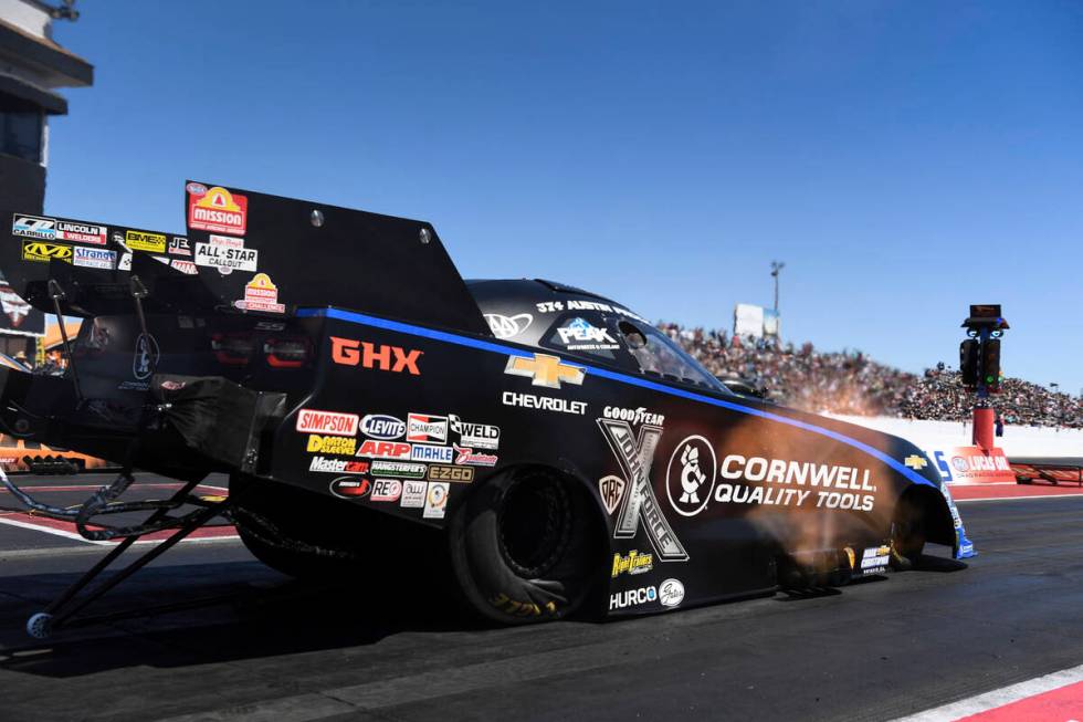 In this photo provided by the NHRA, Austin Prock drives in Funny Car finals at the NHRA Arizona ...