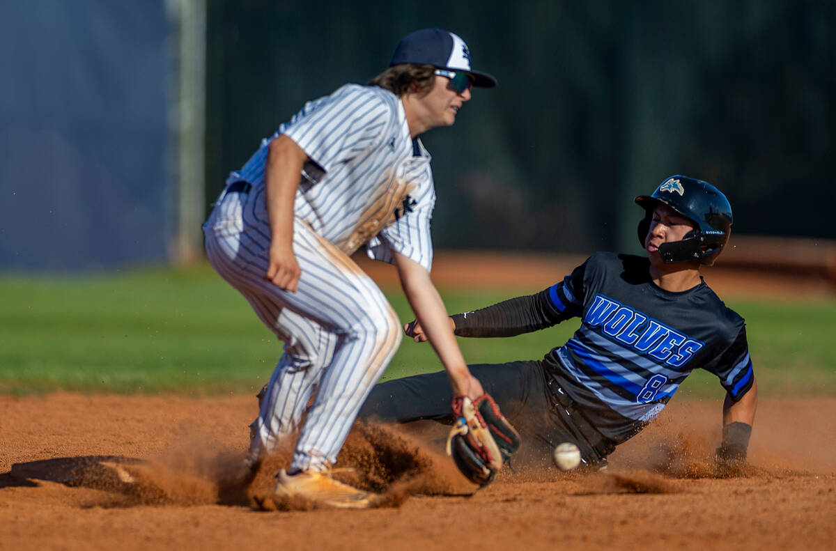 Basic runner Tate Southisene slides safely into second base as the ball arrives late to Spring ...