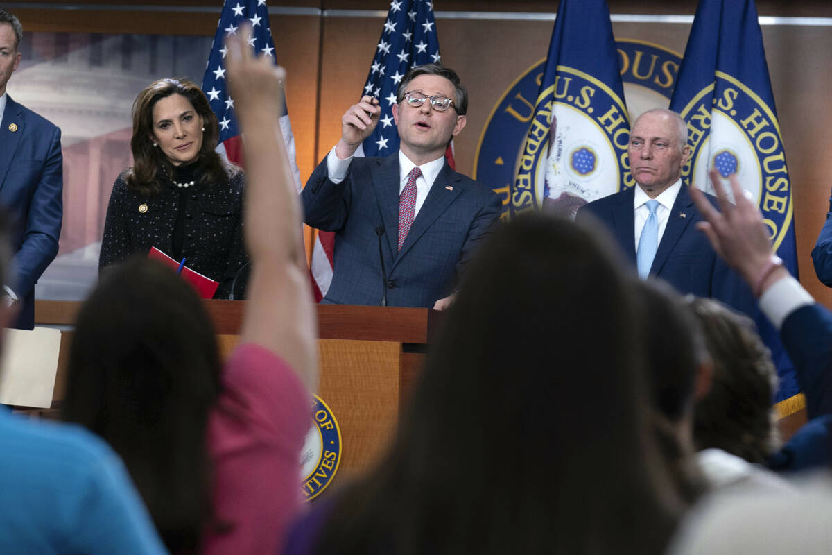 Speaker of the House Mike Johnson, R-La., flanked by Rep. Maria Salazar, R-Fla., left, and Majo ...