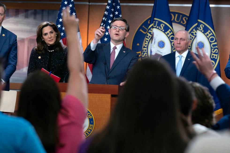 Speaker of the House Mike Johnson, R-La., flanked by Rep. Maria Salazar, R-Fla., left, and Majo ...