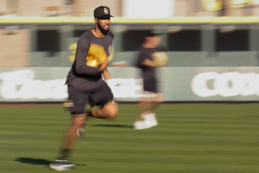 Salt Lake City Bees relief pitcher Amir Garrett runs in from batting practice before a Minor Le ...